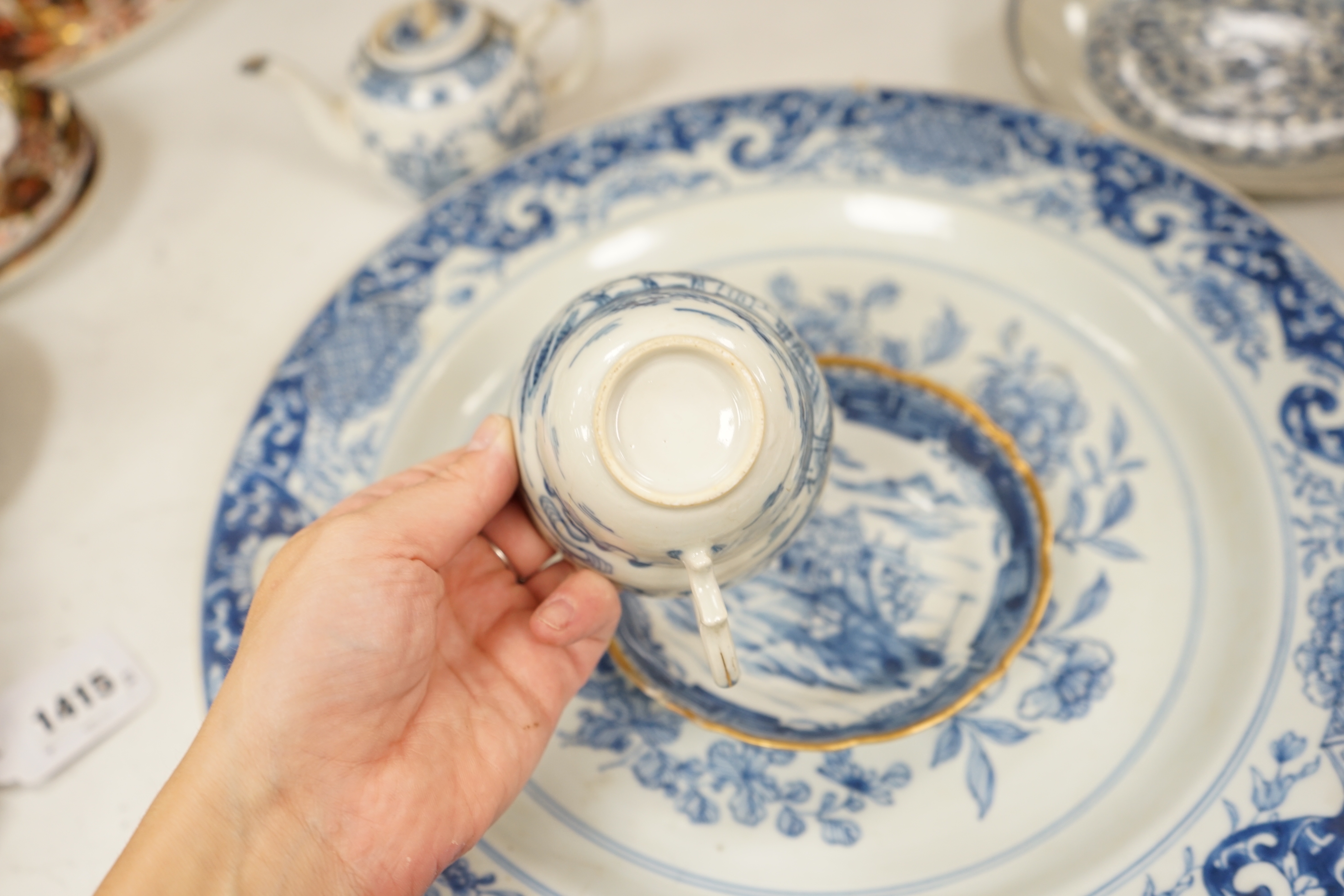 A Worcester teapot, c.1770, two 18th century Chinese porcelain dishes, a cup and saucer, a Chinese shallow bowl and a small teapot, largest dish 39cm